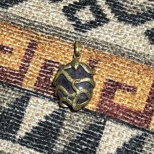 Brass snake and amethyst pendant